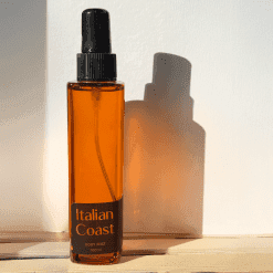 Amber body mist bottle with label
